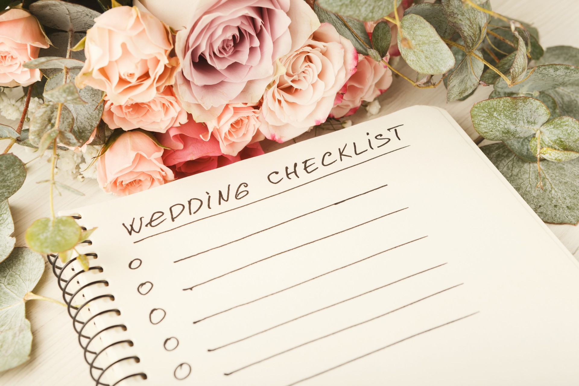 Wedding checklist and rose bouquet